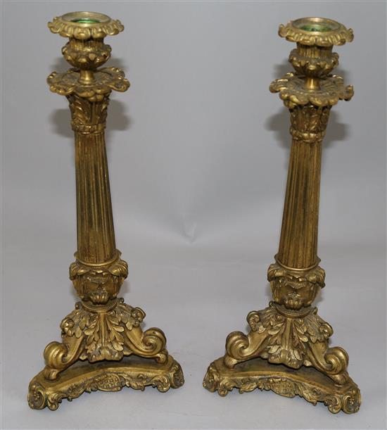 A pair of William IV ormolu candlesticks, 13.5in.